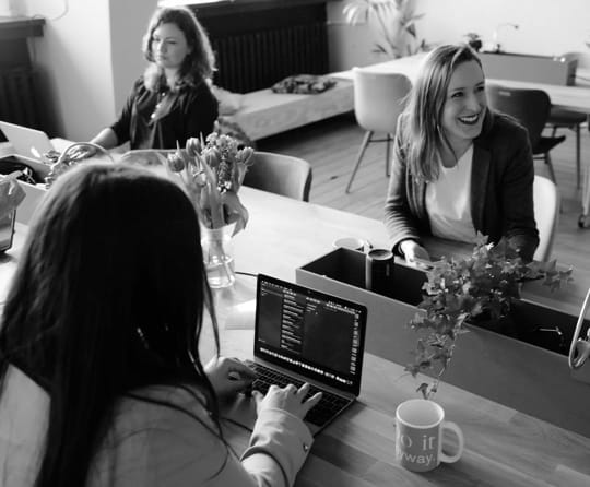 people seated in office laughing